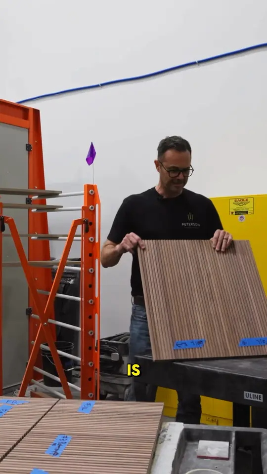 Inside the shop: customer-chosen tambour panels marked top, middle and bottom so the grain runs continuous across an island back and drawer fronts