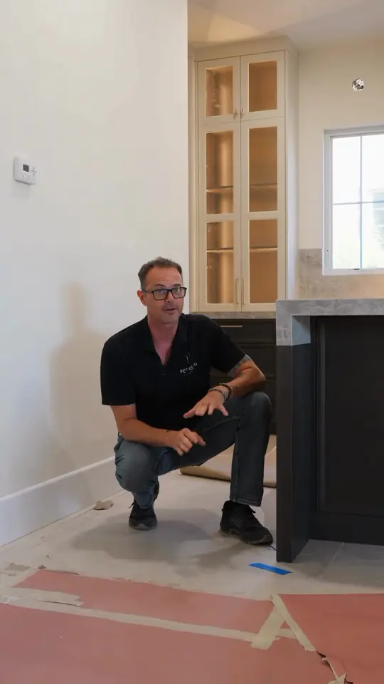 Flooring first or cabinets first? Solid floors and tile go first so island end panels reach the floor; floating floors mean shoe molding