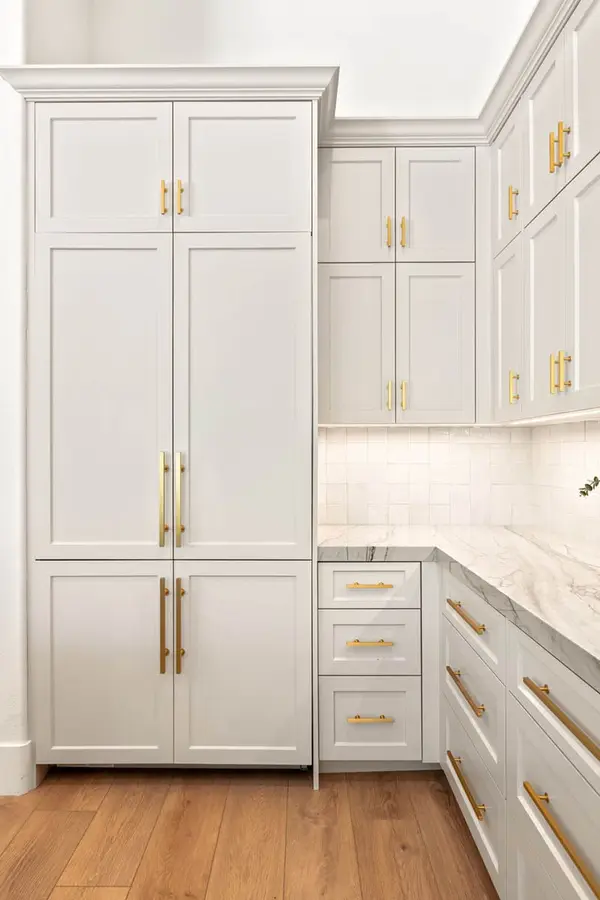 Isleworth Emtec cabinet pulls gosimer vail cabinets custom fridge panels