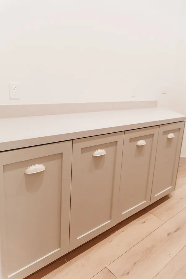 Kevin Way custom laundry room hamper pull outs