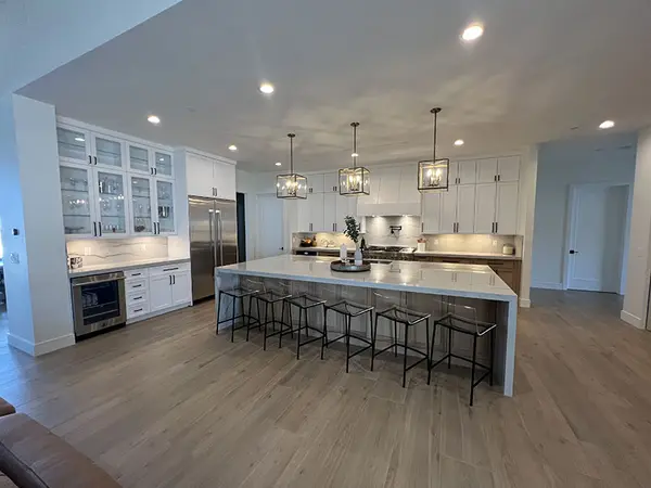 Peterson Cabinet Works Kitchen white shaker doors glass doors led lights rift white oak base cabinets custom hood 4