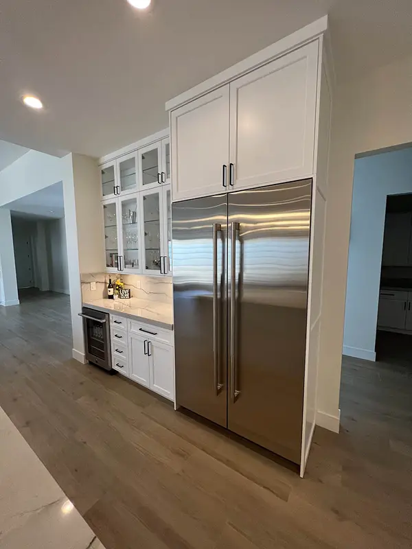 Milan white shaker doors glass doors led lights rift white oak base cabinets custom hood (2)