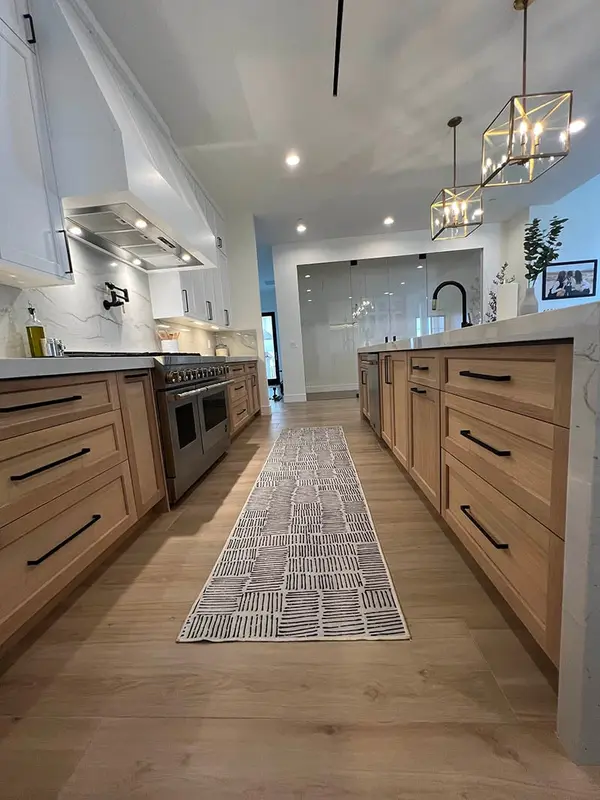 Milan white shaker doorsled lights rift white oak base cabinets custom hood