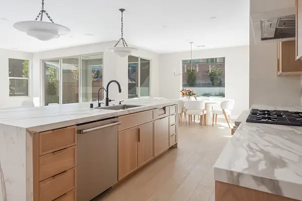 Peterson Cabinet Works Kitchen white shaker doors glass doors led lights rift white oak base cabinets custom hood