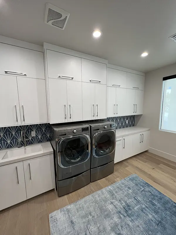 pcw cabinetry Slab custom laundry white