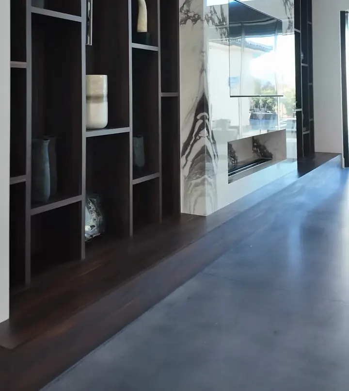 Modern great room panning into a dark-wood kitchen