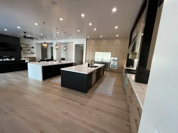 Hammer Matched grain slab rift white oak frameless custom cabinets 2 islands 4