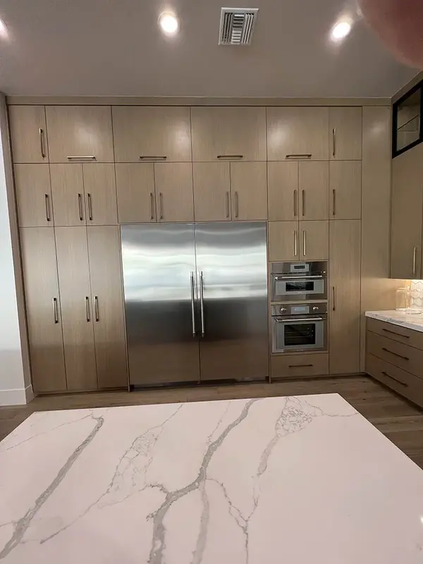 Hammer Matched grain slab rift white oak frameless custom cabinets 3