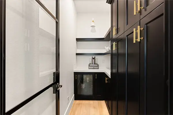 Isleworth custom pantry tricorn black glass door floating shelves