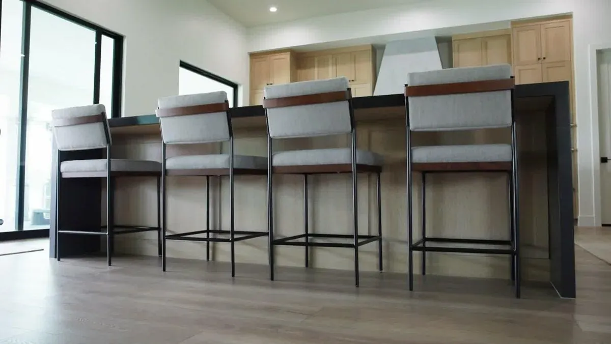 Finished custom kitchen island with waterfall countertop and bar seating in Las Vegas