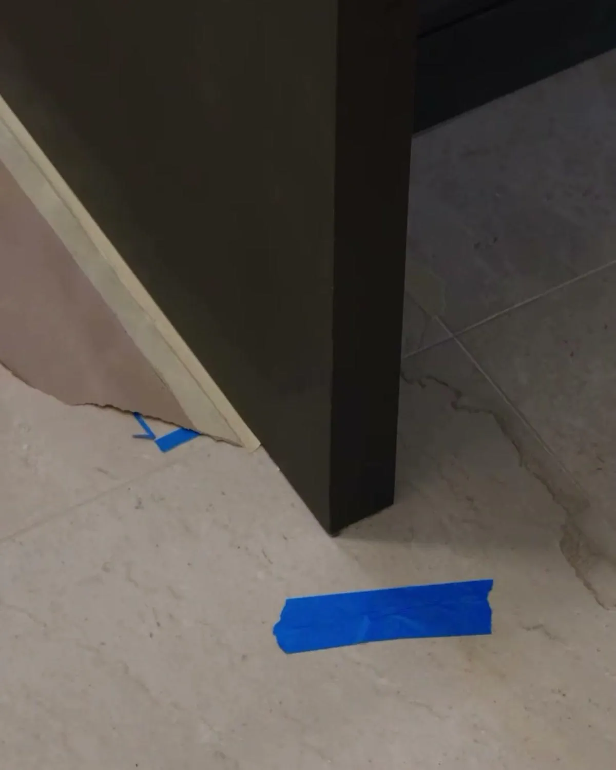Close-up of a custom cabinet end panel where tile will meet the cabinet base