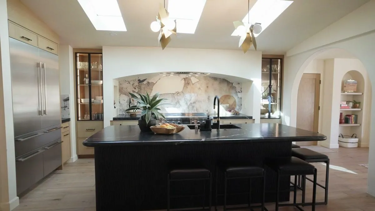 Remodeled 1941 bungalow kitchen with custom wood cabinets and black island near Las Vegas
