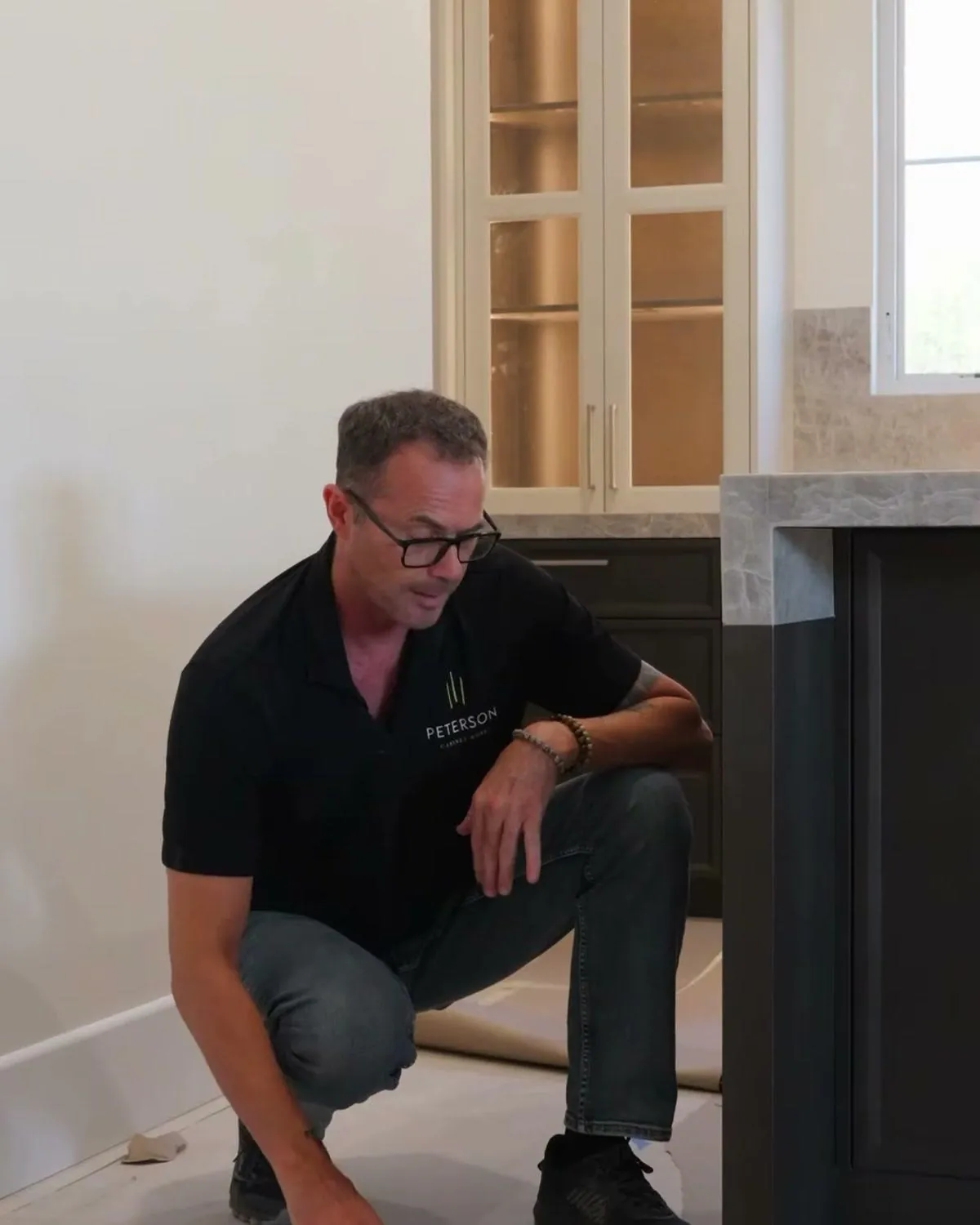 Dave Peterson answering flooring and cabinet order questions in a Las Vegas kitchen