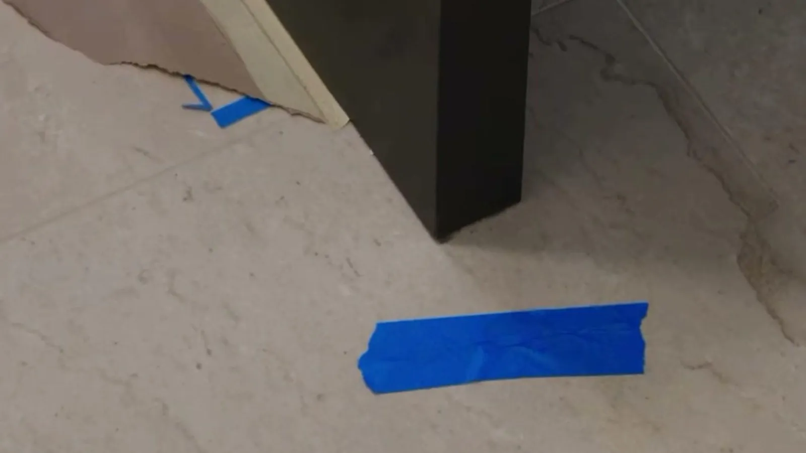 Custom cabinet island end panel meeting the subfloor before tile in a Las Vegas kitchen
